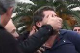 # Manifestant baillonné par la police lors de son arrestation pour avoir crié "Vive le Tibet libre"